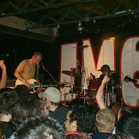 Fugazi, playing live in 2002