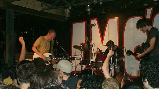 Fugazi, playing live in 2002